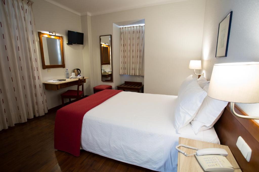 Postel nebo postele na pokoji v ubytování Hotel Solaris