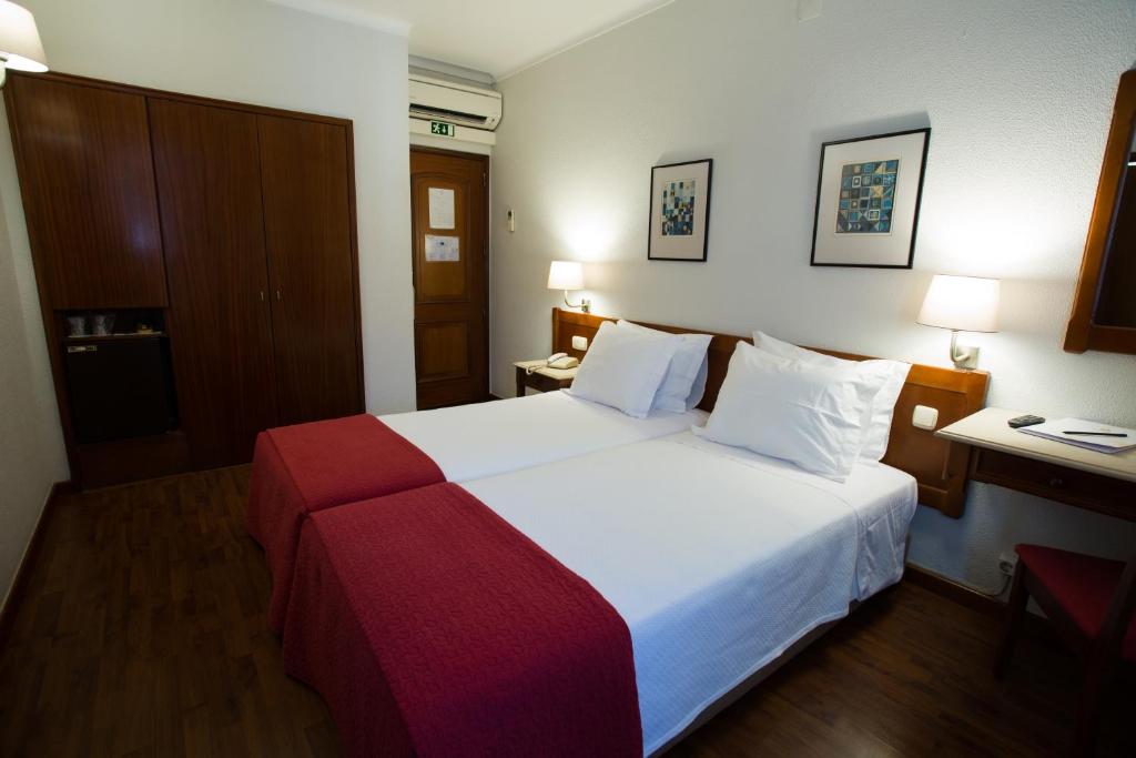 Postel nebo postele na pokoji v ubytování Hotel Solaris
