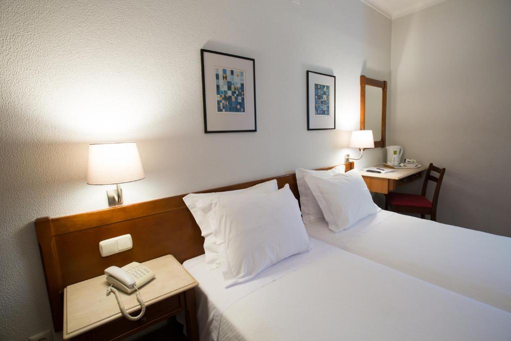 Postel nebo postele na pokoji v ubytování Hotel Solaris