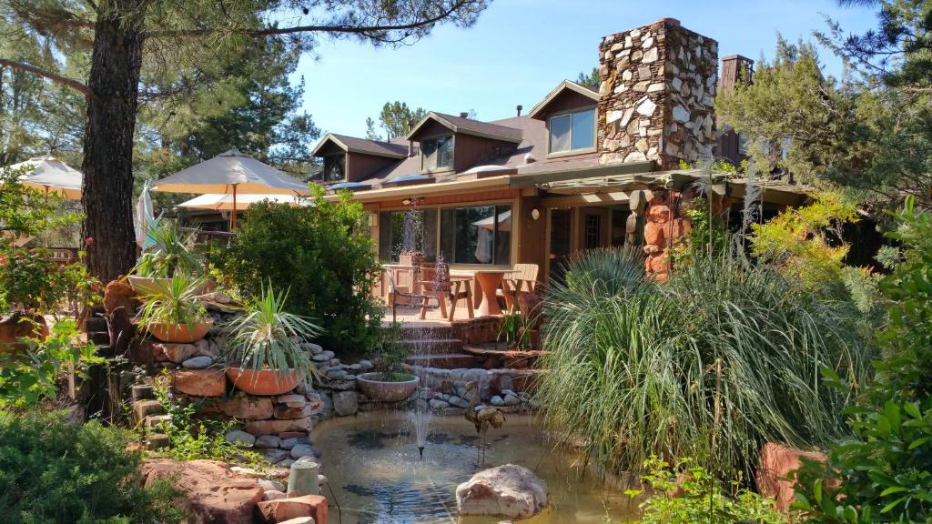a house with a pond in front of it at Lodge at Sedona in Sedona
