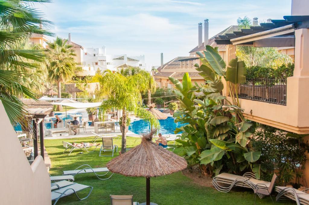 a view of a resort yard with a pool at Aloha Hill Club Apartment in Marbella