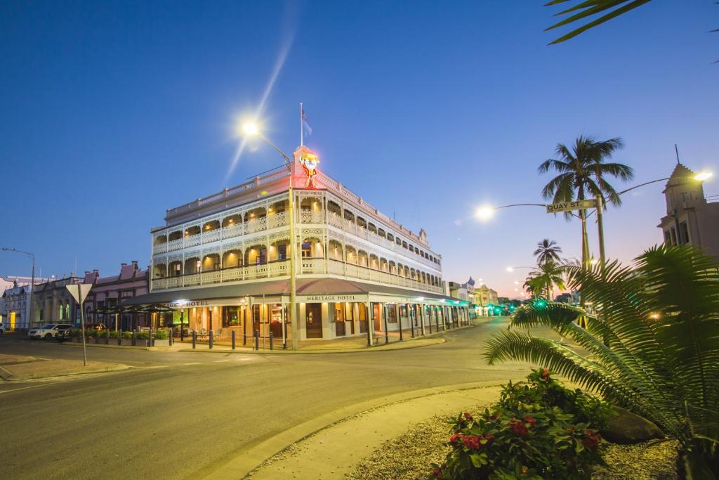 a large building with a clock on the side of it at Heritage Hotel Rockhampton in Rockhampton
