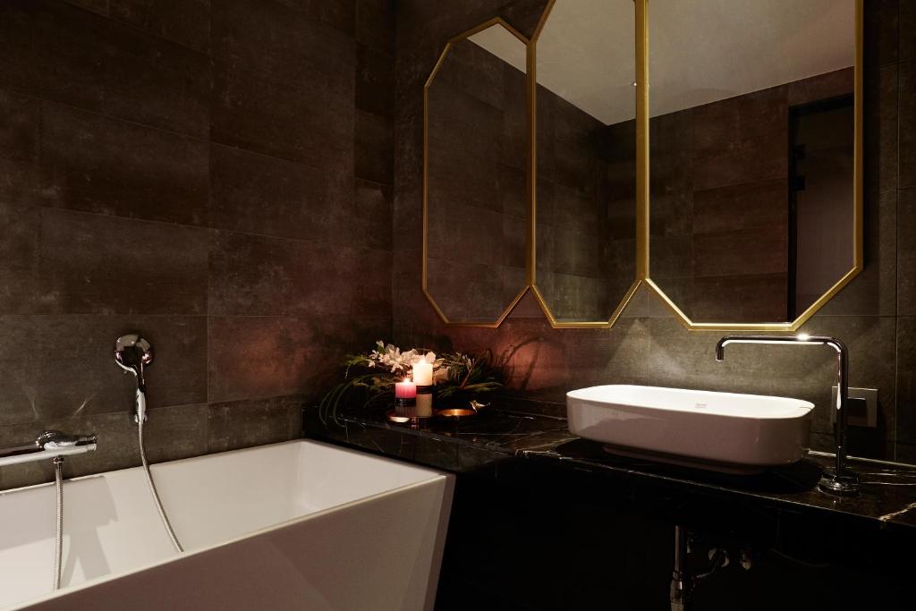 Koupelna v ubytování Roseto Hotel