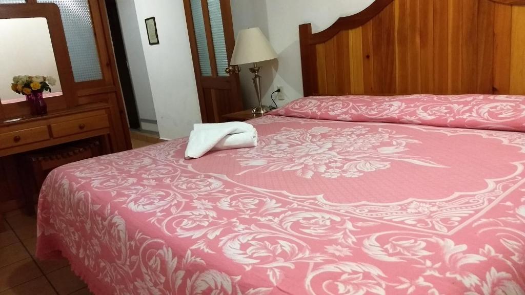 Postel nebo postele na pokoji v ubytování Posada Cuallicochi