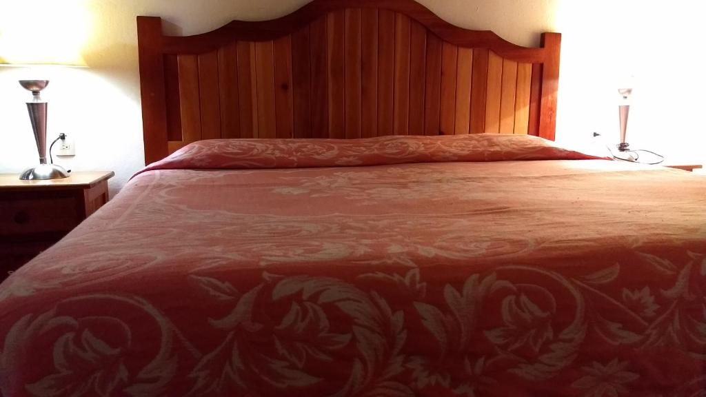 Postel nebo postele na pokoji v ubytování Posada Cuallicochi