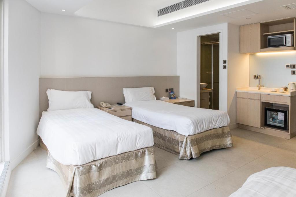 Postel nebo postele na pokoji v ubytování Wifi Boutique Hotel
