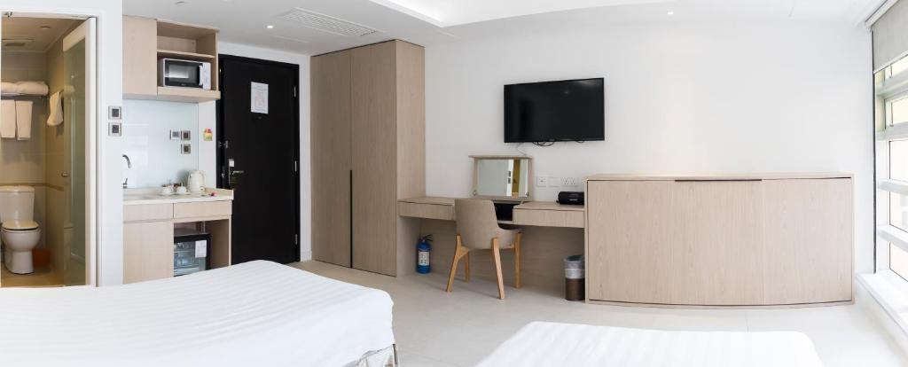 TV a/nebo společenská místnost v ubytování Wifi Boutique Hotel