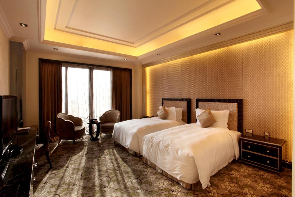 Postel nebo postele na pokoji v ubytování Chateau Star River Pudong Shanghai