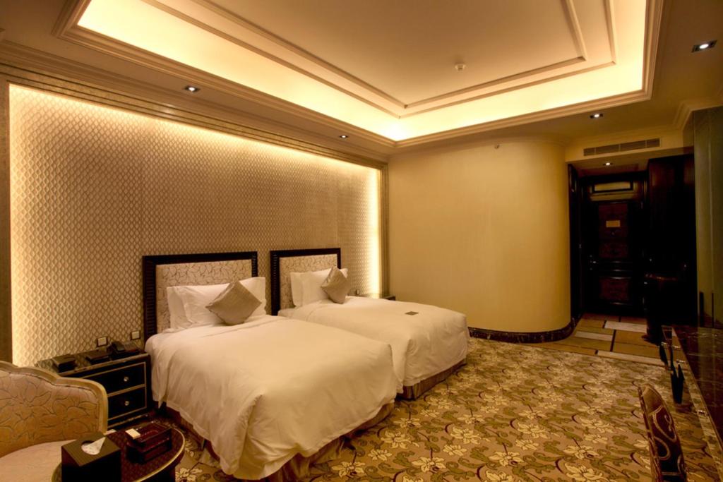 Postel nebo postele na pokoji v ubytování Chateau Star River Pudong Shanghai