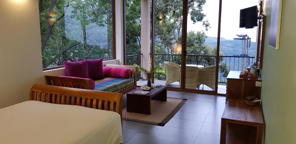 Postel nebo postele na pokoji v ubytování Ella Planters Bungalow
