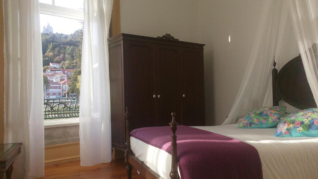 Postel nebo postele na pokoji v ubytování A Vianesa - Guest House