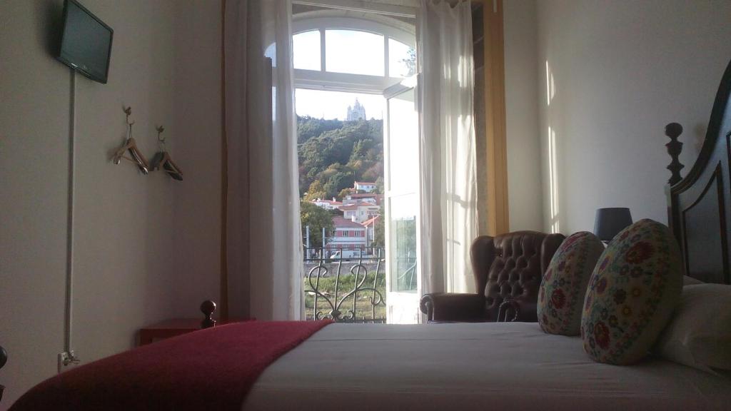 Postel nebo postele na pokoji v ubytování A Vianesa - Guest House