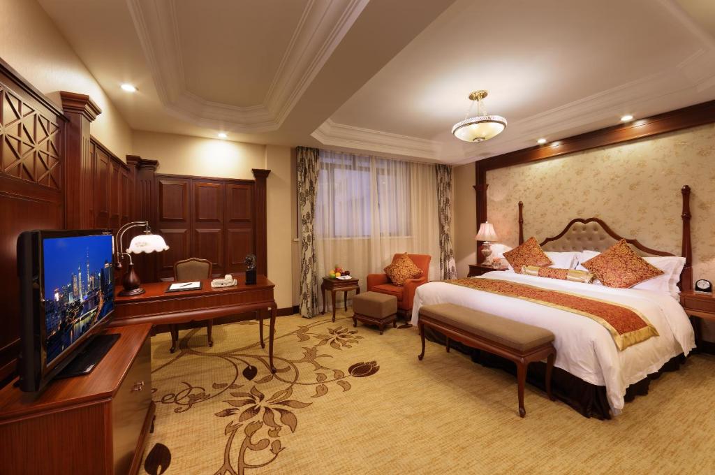 TV a/nebo společenská místnost v ubytování Jin Jiang Pacific Hotel