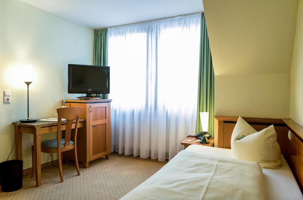 Postel nebo postele na pokoji v ubytování Ringhotel Dreiländereck Zittau