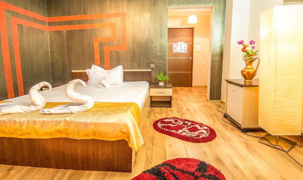Postel nebo postele na pokoji v ubytování Hotel EOS