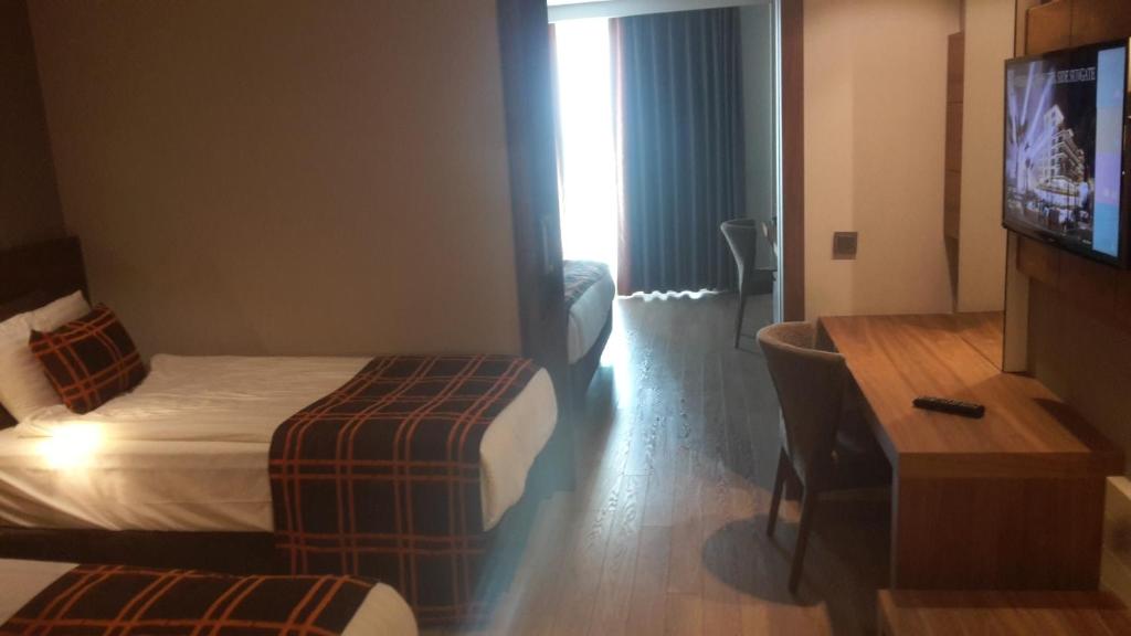 Postel nebo postele na pokoji v ubytování Side Sunport Hotel - All Inclusive