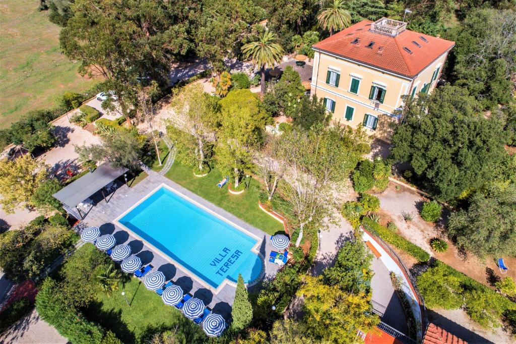 an overhead view of a house and a swimming pool at Villa Teresa in Porto Azzurro