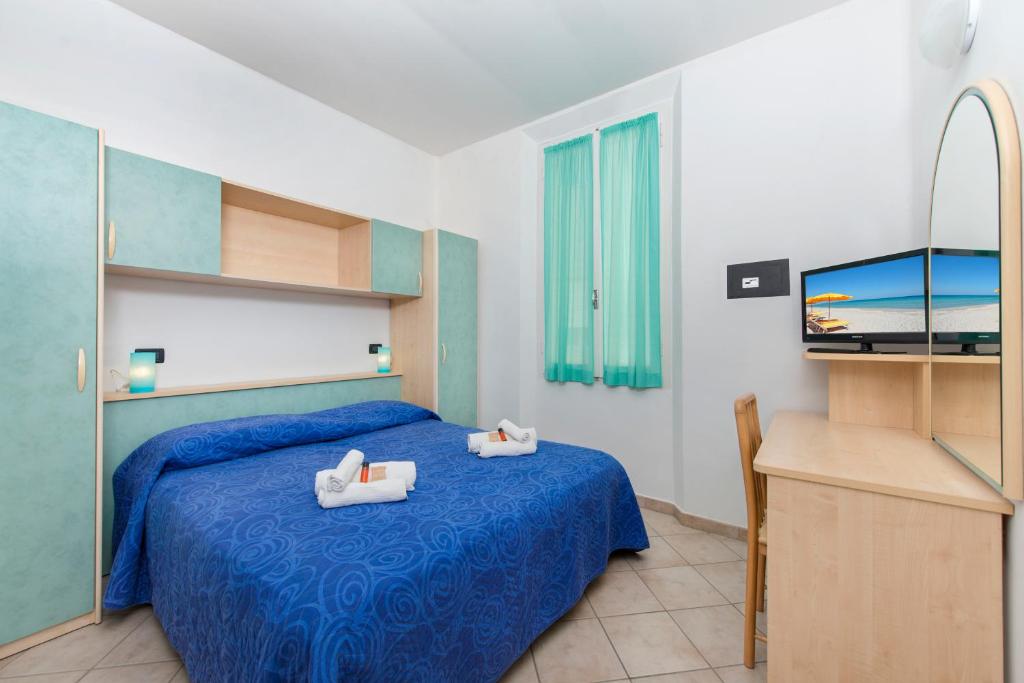 Postel nebo postele na pokoji v ubytování Hotel Sogno