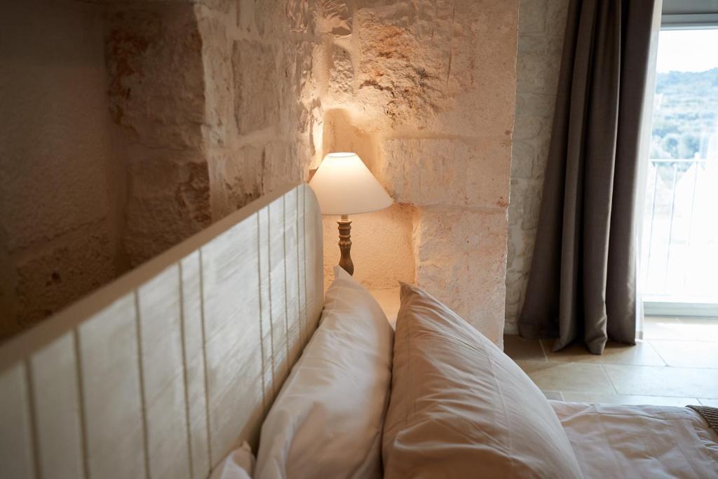 Postel nebo postele na pokoji v ubytování Masseria Grieco