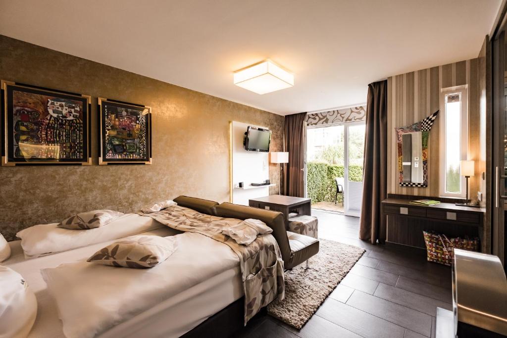 Postel nebo postele na pokoji v ubytování Hotel Kolb