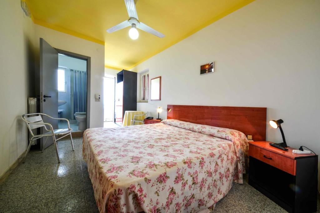 Postel nebo postele na pokoji v ubytování Hotel Piccolo Paradiso