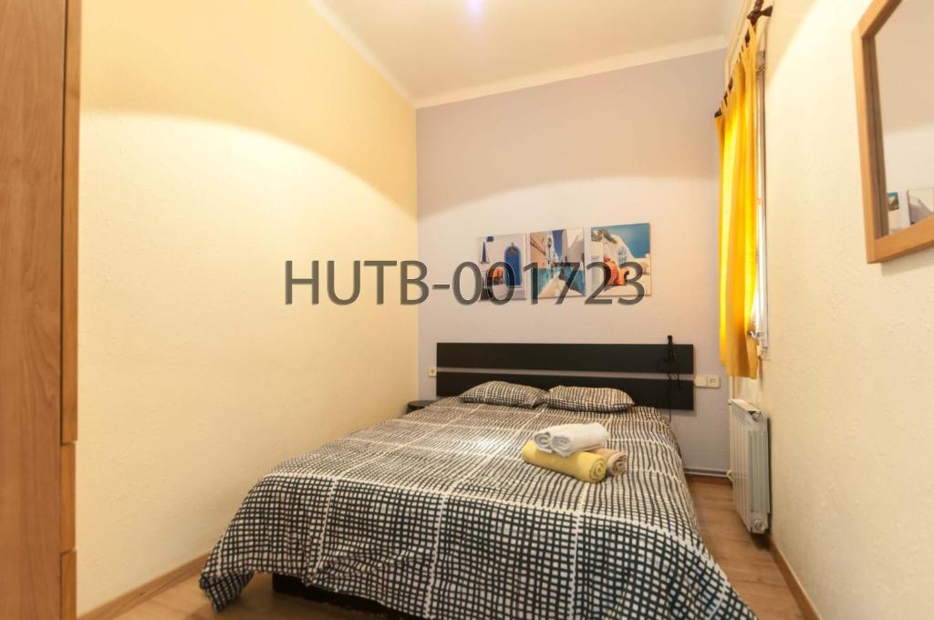 Postel nebo postele na pokoji v ubytování Go-BCN Residence Sagrada Familia