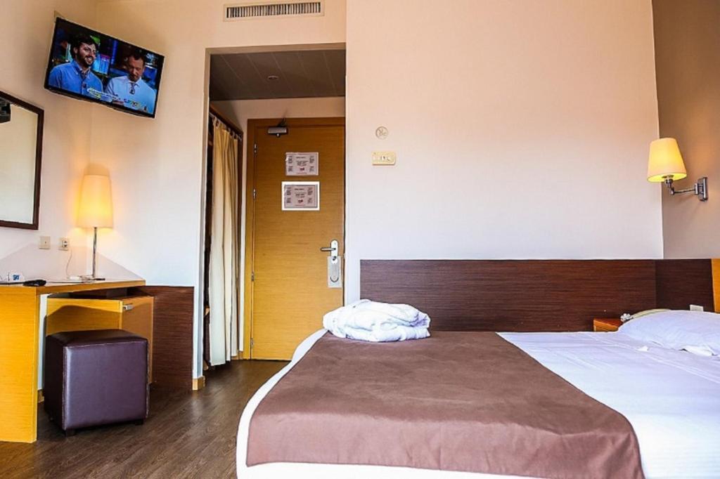 Postel nebo postele na pokoji v ubytování Hotel Sisto V