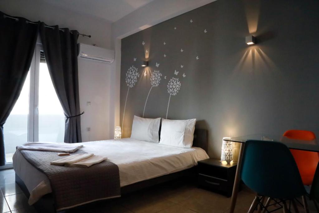 Postel nebo postele na pokoji v ubytování Omonoia Boutique Apartment