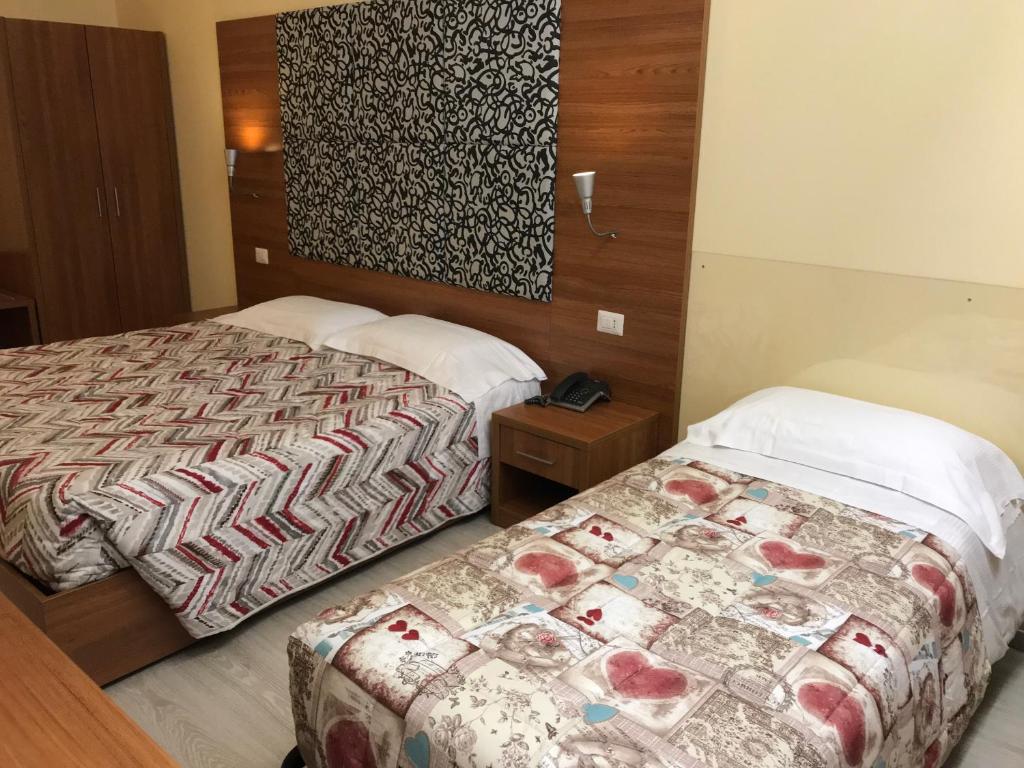 Postel nebo postele na pokoji v ubytování Hotel Elys