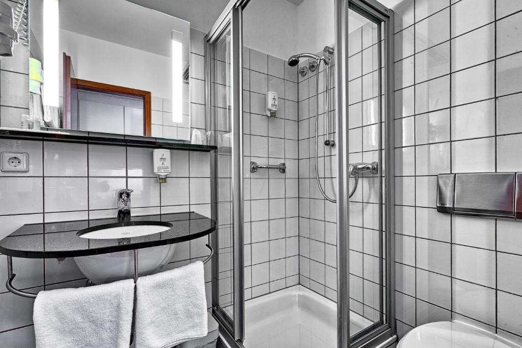 Koupelna v ubytování attimo Hotel Stuttgart***S