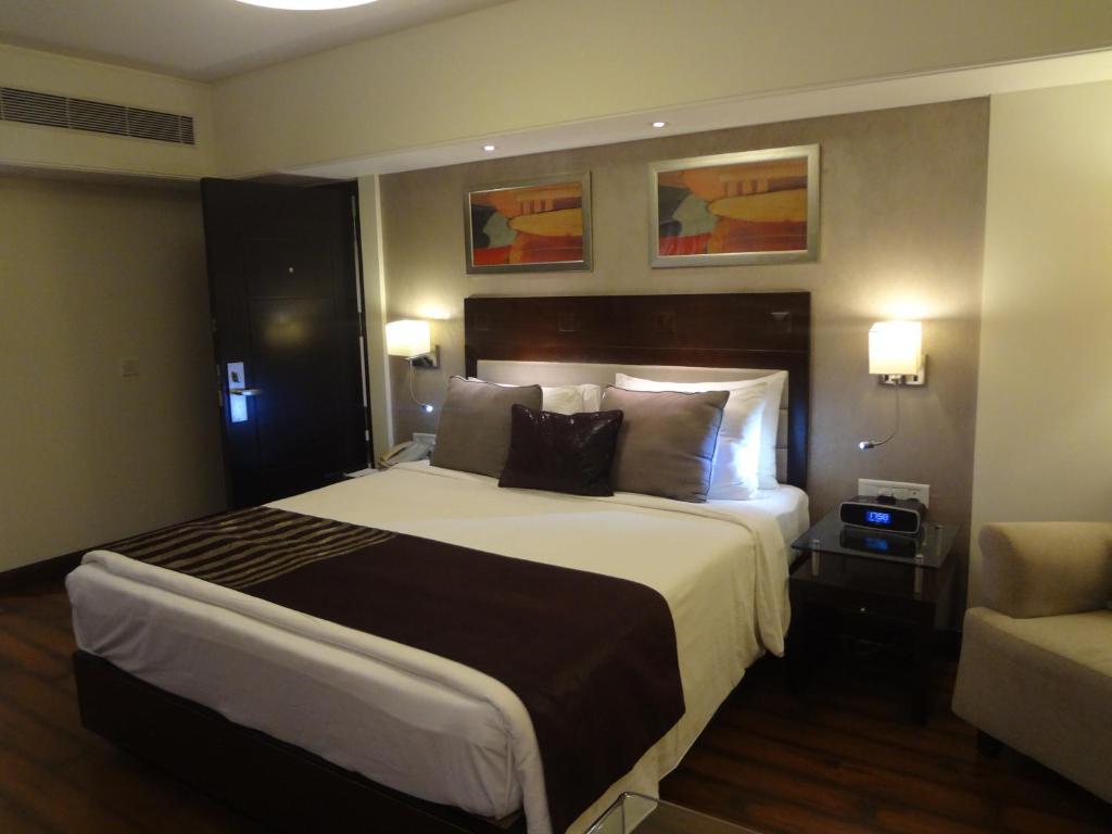 Postel nebo postele na pokoji v ubytování Fortune Park, Ahmedabad - Member ITC Hotels' Group