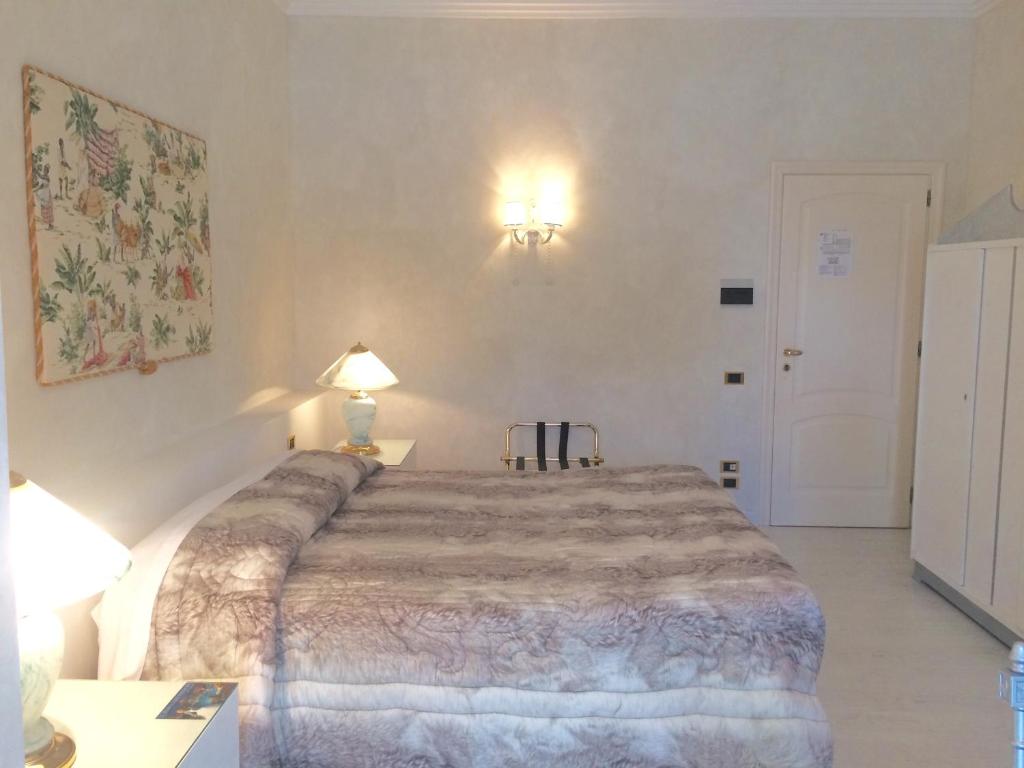 Postel nebo postele na pokoji v ubytování Hotel Parco dei Principi