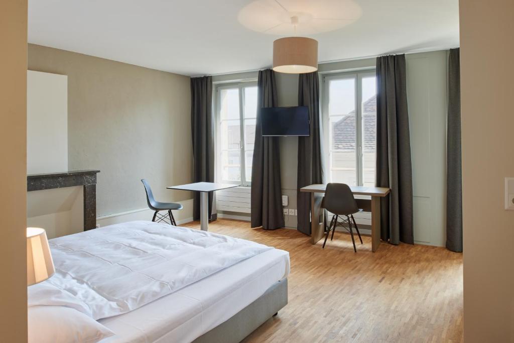 Postel nebo postele na pokoji v ubytování Aparthotel Hine Adon Fribourg