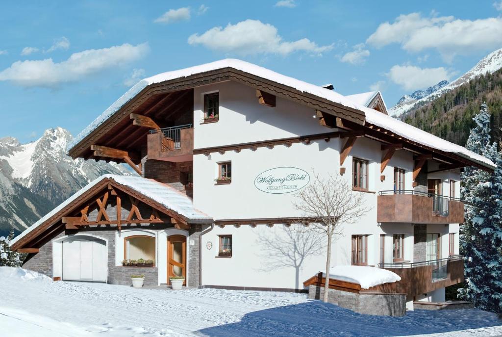 a house in the snow with snow covered at Apart Wolfgang Birkl in Sankt Anton am Arlberg