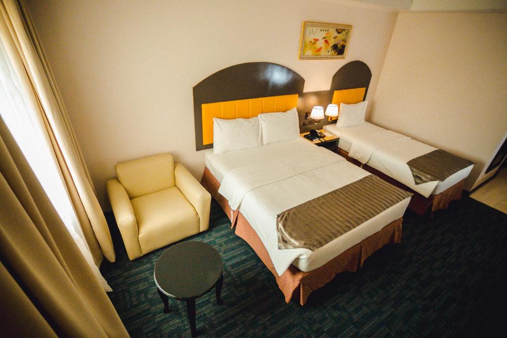 Postel nebo postele na pokoji v ubytování Butuan Grand Palace Hotel