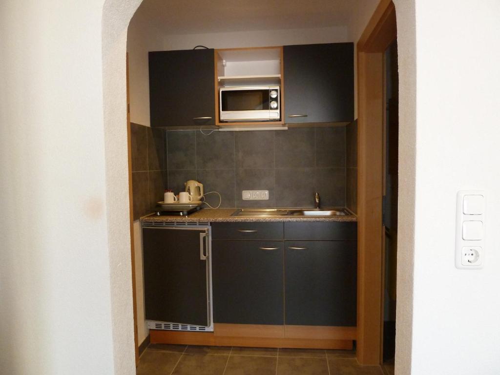 Kuchyň nebo kuchyňský kout v ubytování Alpina Appartements