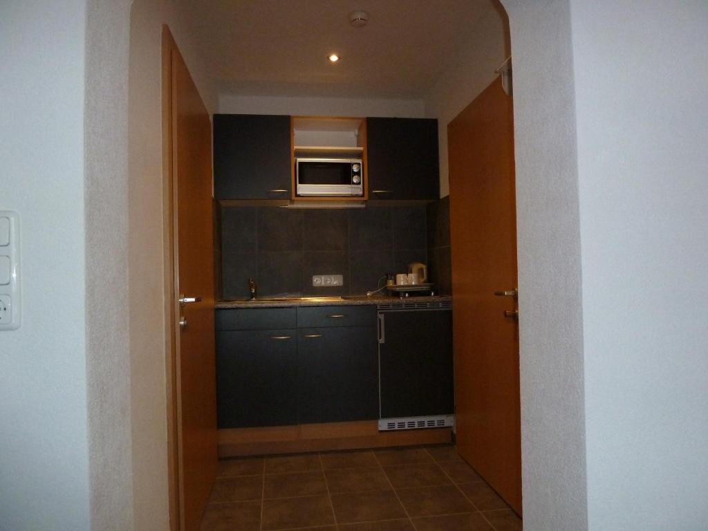 Kuchyň nebo kuchyňský kout v ubytování Alpina Appartements