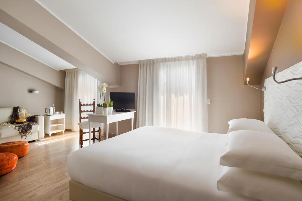 Postel nebo postele na pokoji v ubytování Albergo La Pace