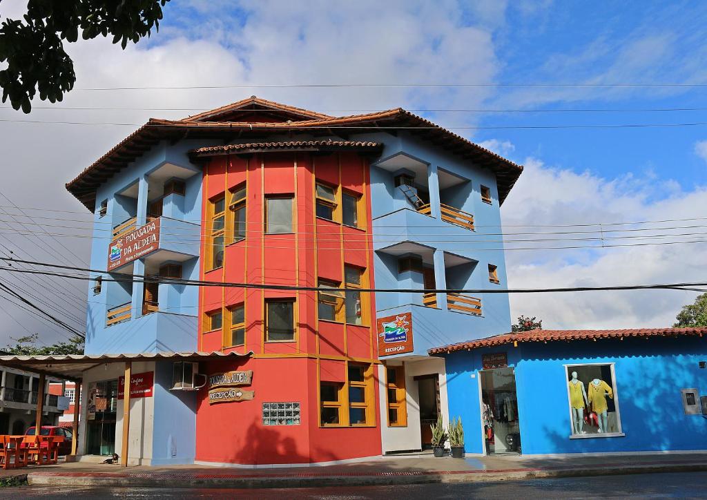 a colorful building on the side of a street at Pousada da Aldeia in Serra