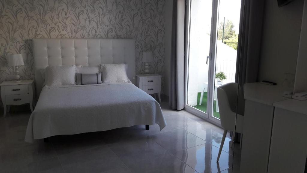 Postel nebo postele na pokoji v ubytování Hotel Villaclara