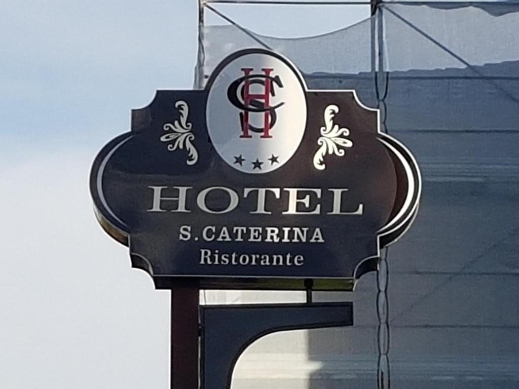 a sign for a hotel on the side of a building at Hotel Santa Caterina in Fisciano