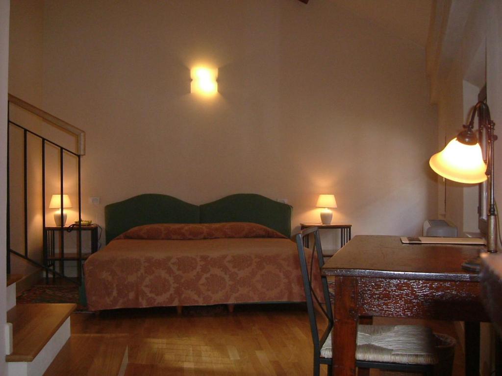 Postel nebo postele na pokoji v ubytování Hotel De Prati