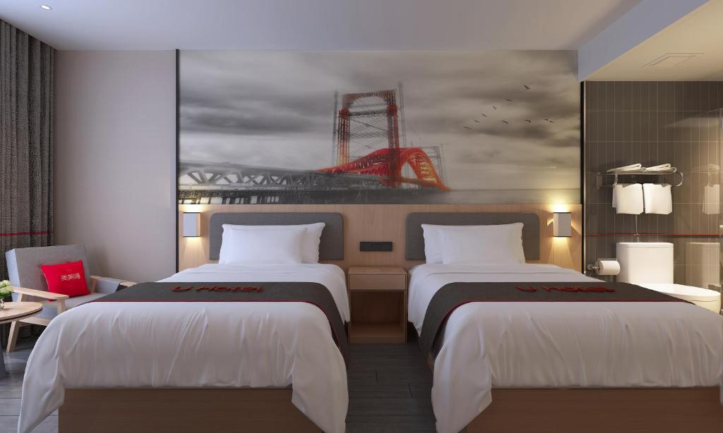 מיטה או מיטות בחדר ב-Thank Inn Chain Hotel Anhui Liuan Huoshan County Coach Station