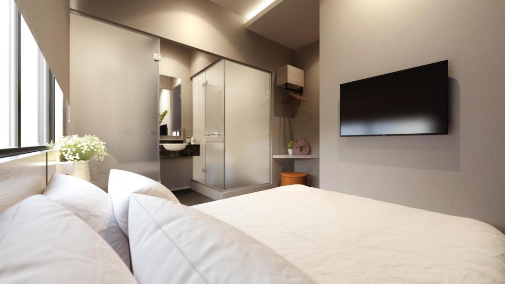 TV a/nebo společenská místnost v ubytování The Square Hotel