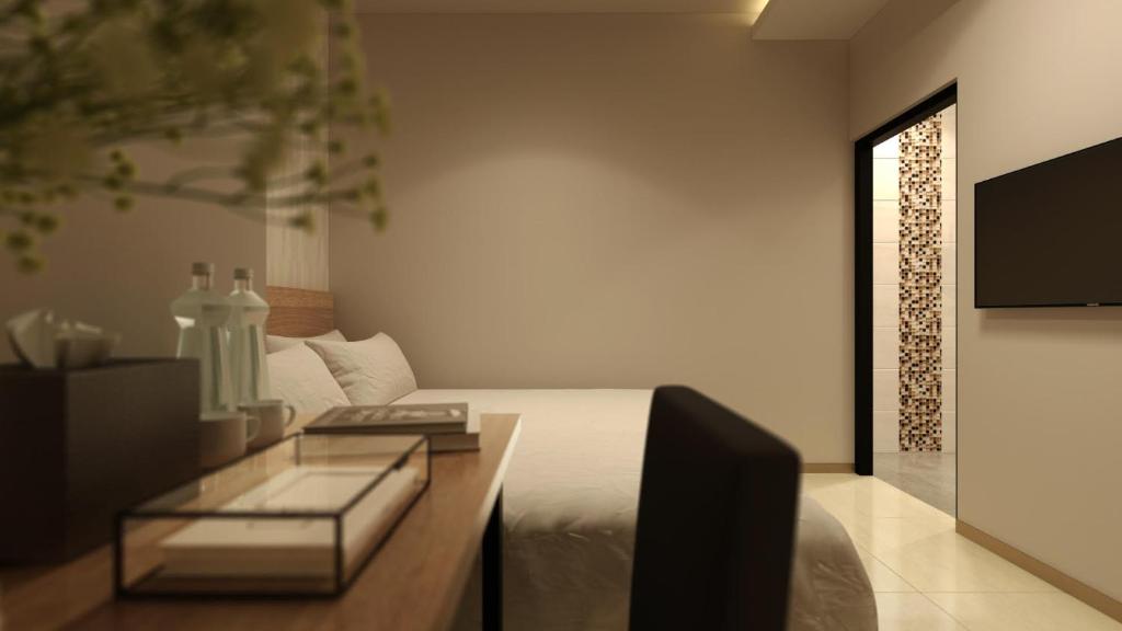 TV a/nebo společenská místnost v ubytování The Square Hotel