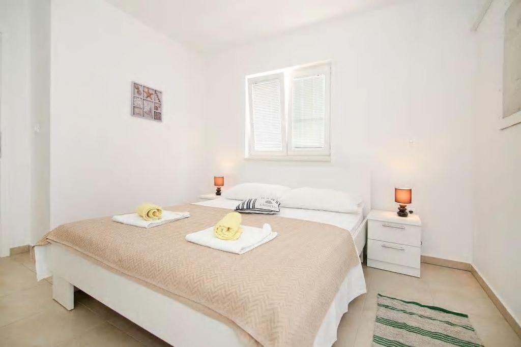 Postel nebo postele na pokoji v ubytování Mimice Bay Apartments