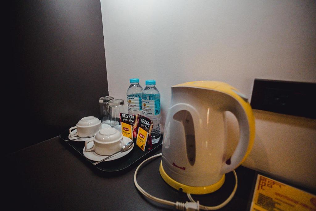 Příslušenství pro přípravu čaje a kávy v ubytování Butuan Grand Palace Hotel