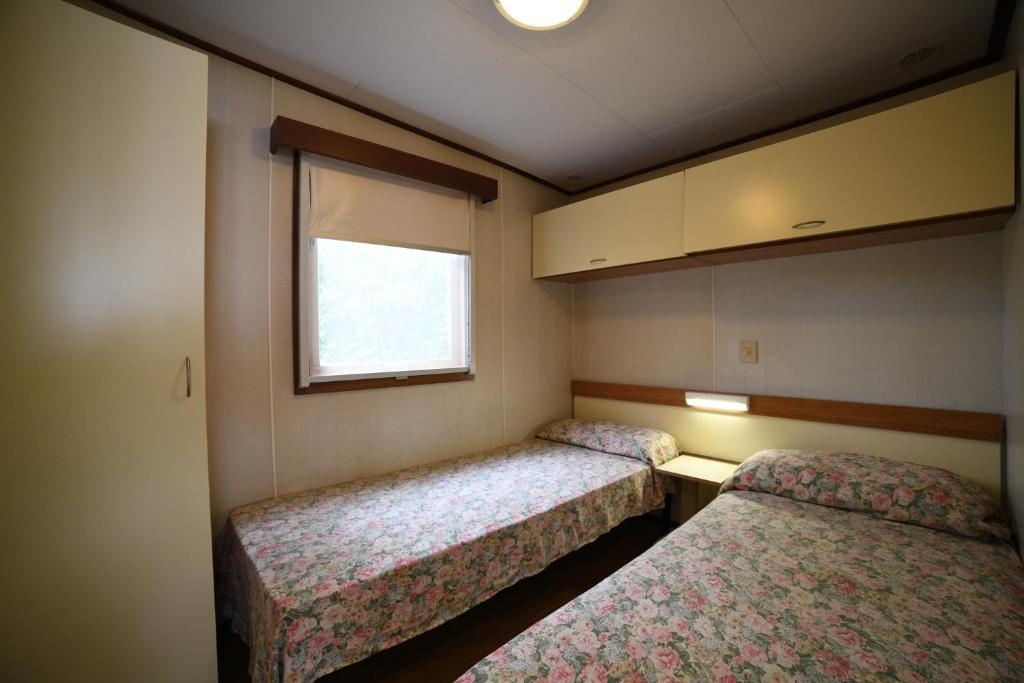 Postel nebo postele na pokoji v ubytování Camping C'era Una Volta