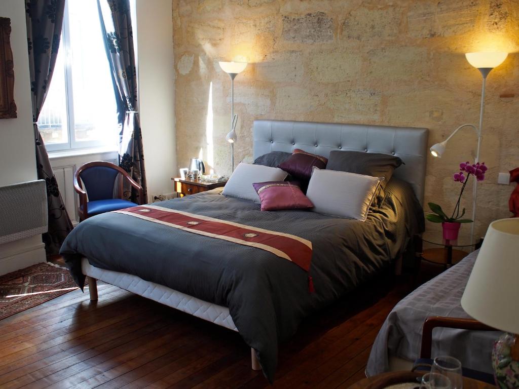 Posteľ alebo postele v izbe v ubytovaní Les Chambres d'Art