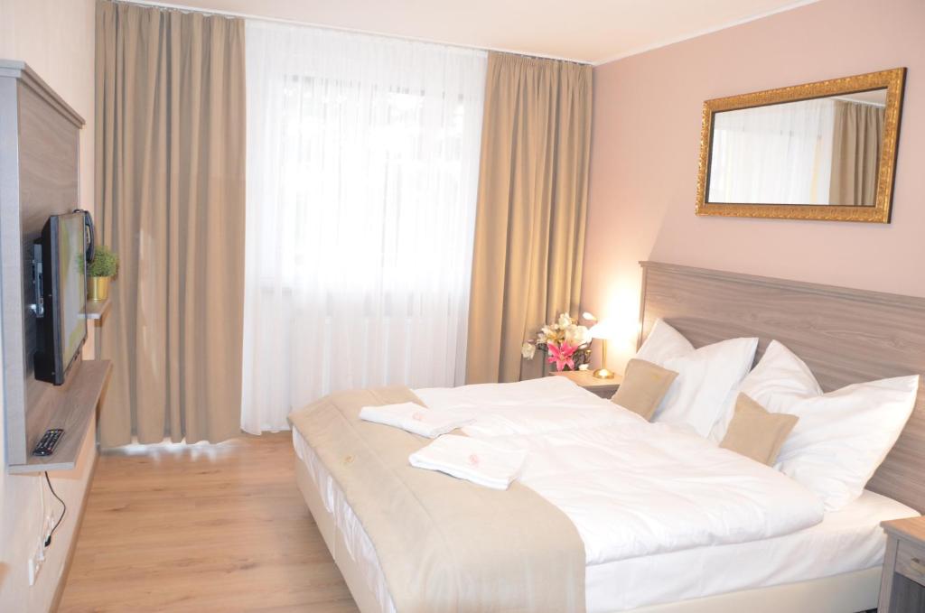 Postel nebo postele na pokoji v ubytování Resort Erich